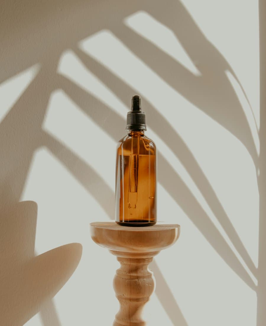 A white ceramic ultrasonic aroma diffuser emitting a light mist.