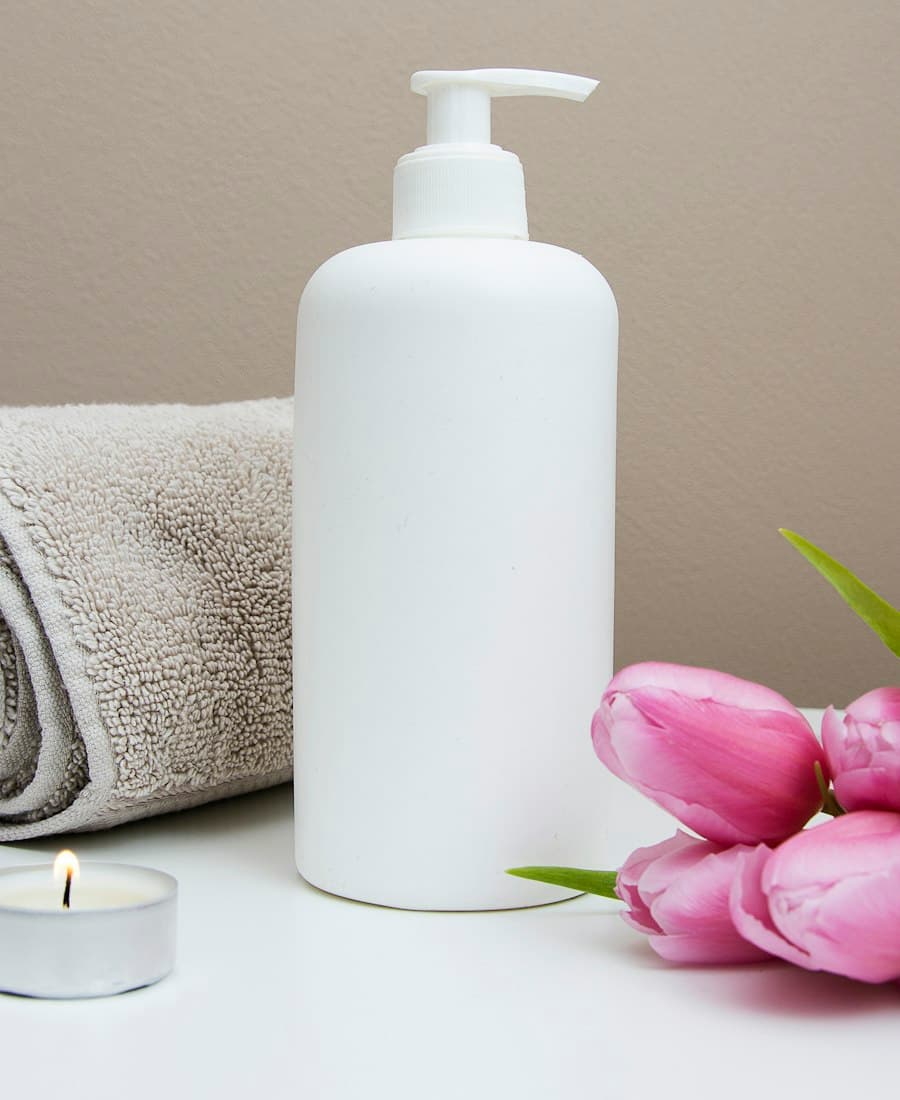 A silk lavender-scented eye pillow resting on a white towel.
